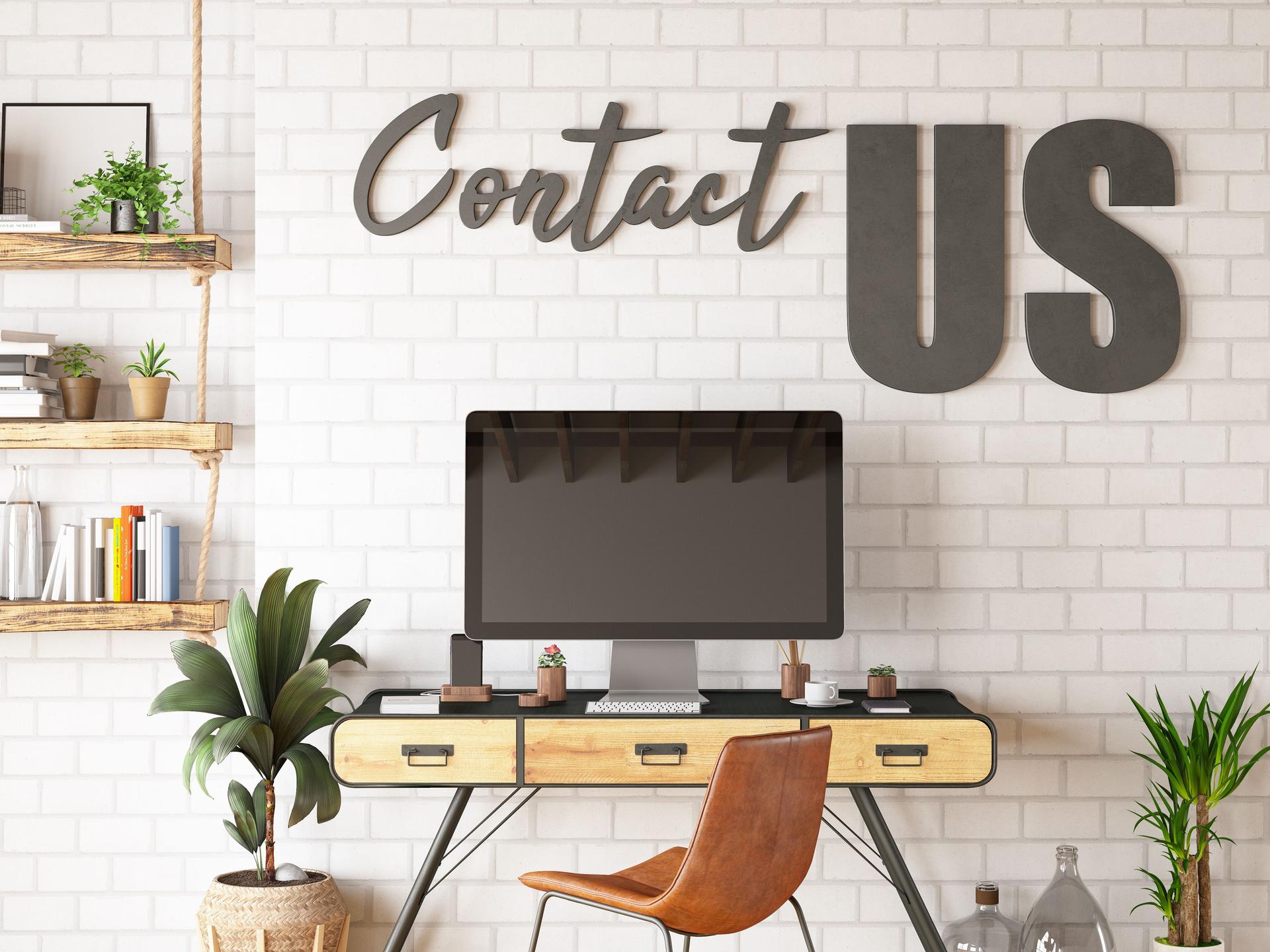 Contact Us Sign with Work Space and Computer